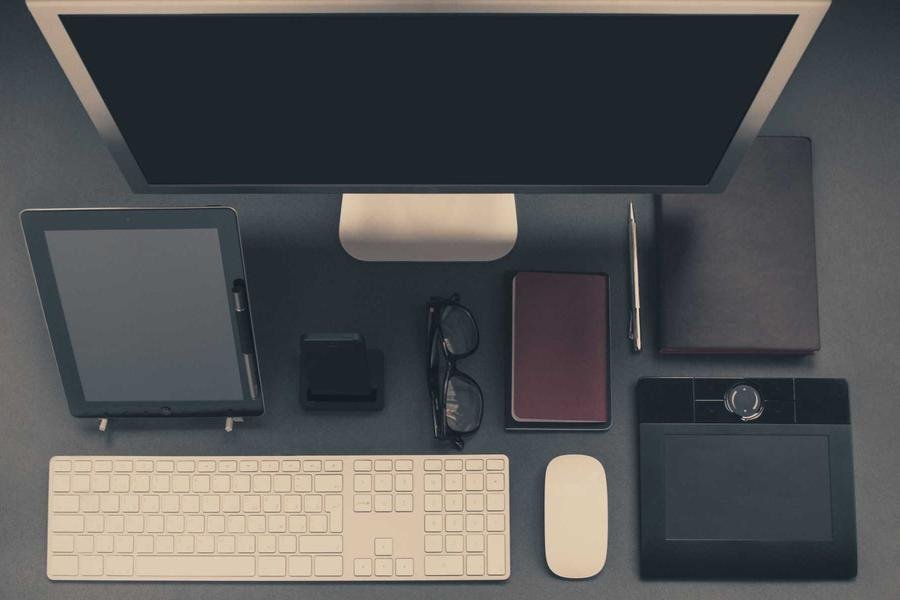 Desk flat lay with computer and tablet | Techyza WordPress Development Agency